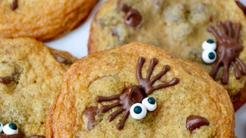 A close-up of Spider Chocolate Chip Cookies stacked on top of each other