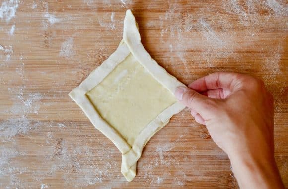 Folding puff pastry into a diamond-shaped Danish