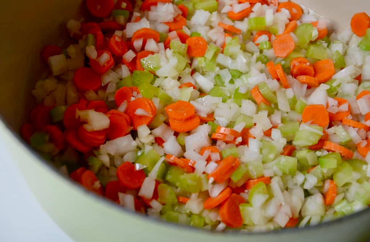 Sautéed carrots, onion and celery in the bottom of a large stockpot.