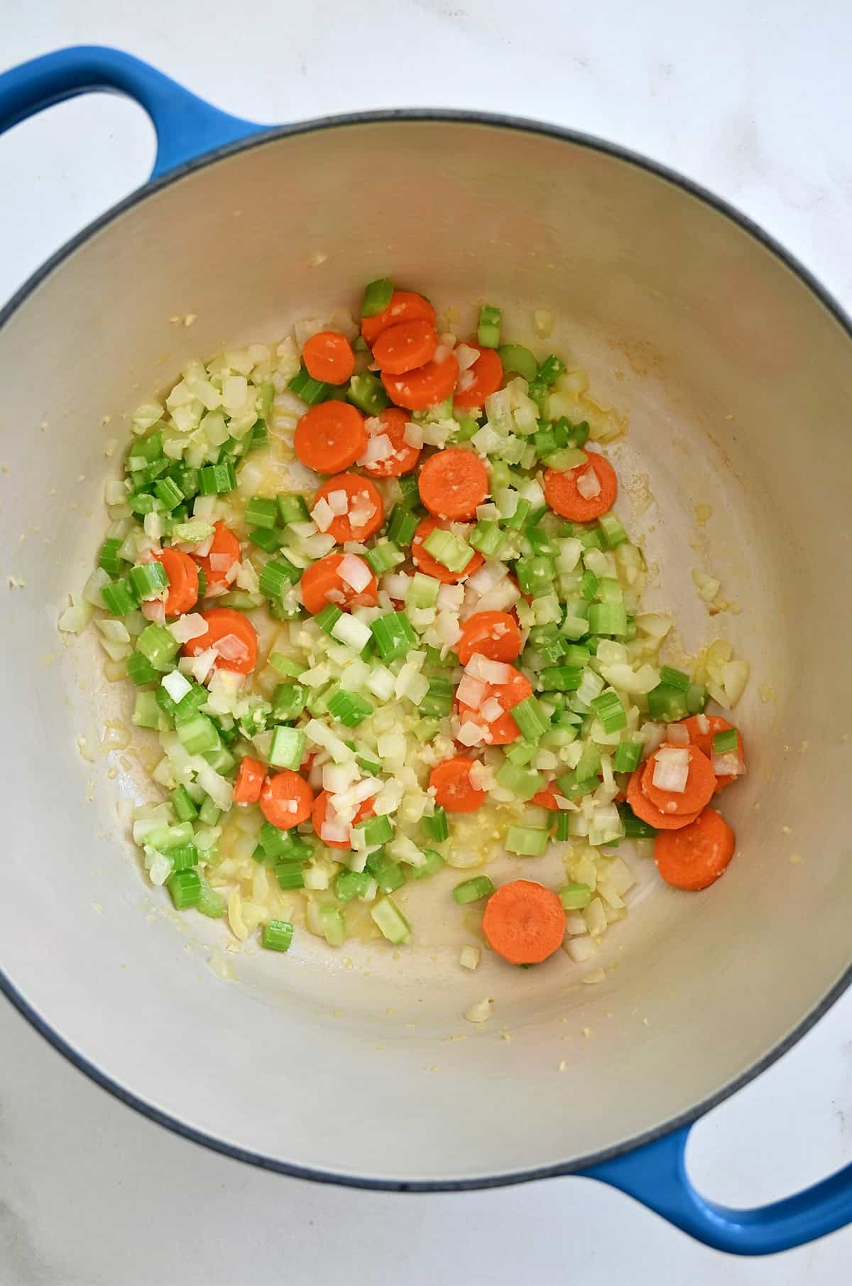 Sautéed carrots, onion and celery in the bottom of a large stockpot.