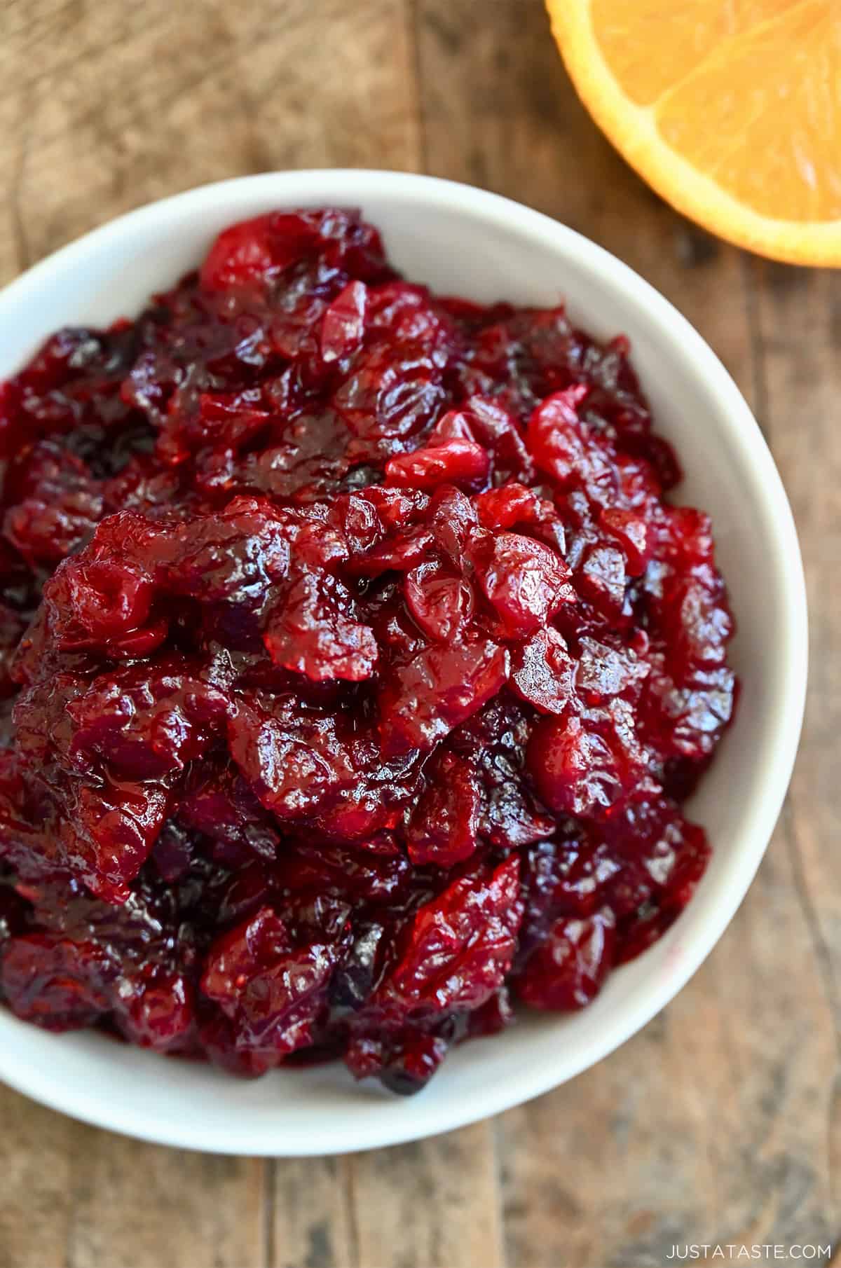 Cranberry orange sauce in a white serving bowl.