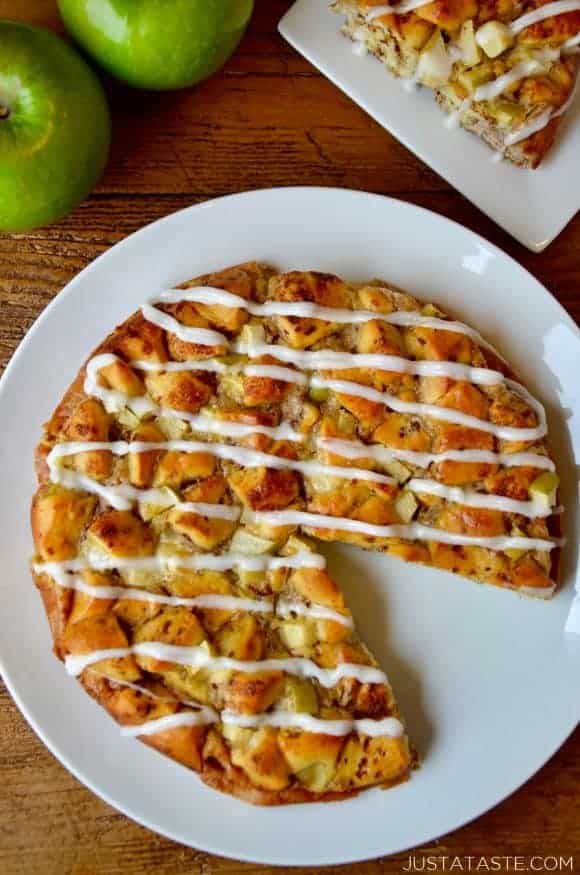 A white plate containing Apple Cinnamon Roll Bake with a slice cut out