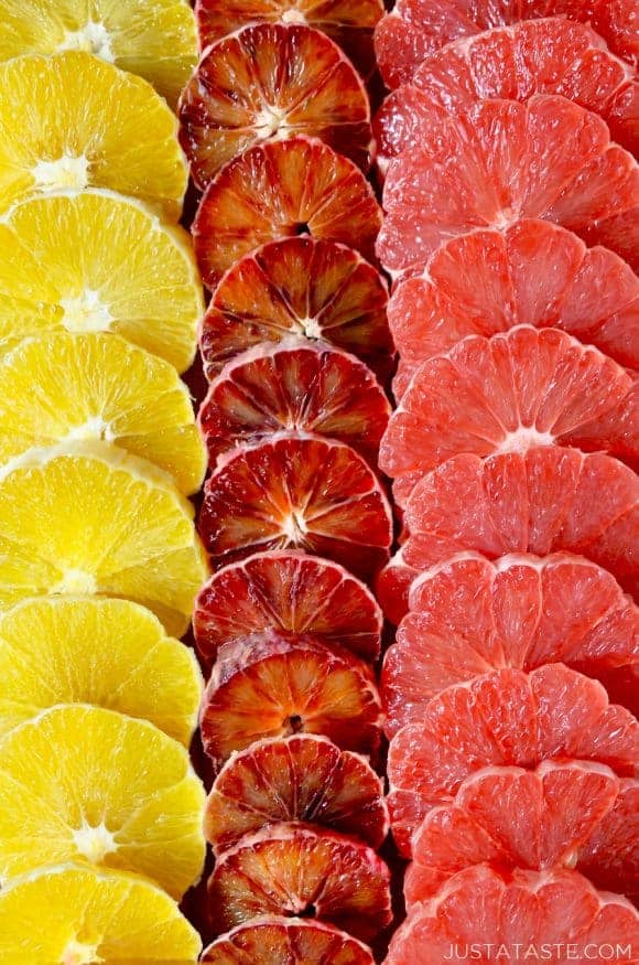 A close-up of sliced oranges, blood oranges and grapefruits