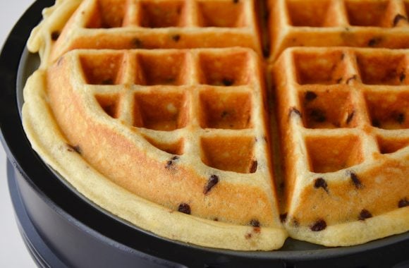 Cooked buttermilk chocolate chip waffle in waffle maker.