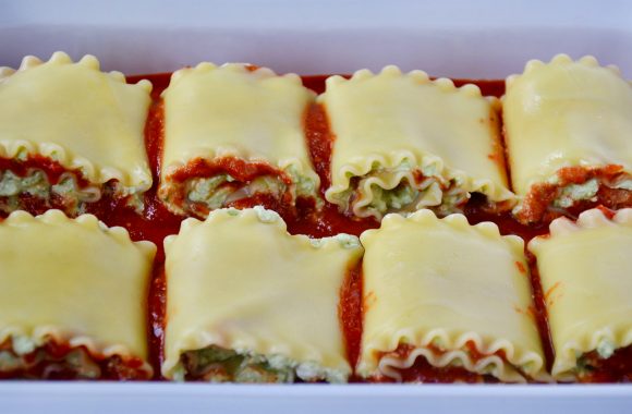 Easy lasagna roll-ups in white baking dish