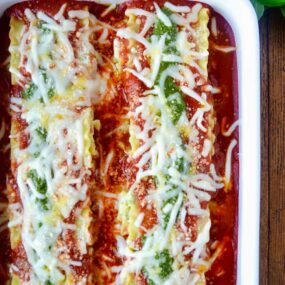 Easy Pesto Lasagna Roll-Ups in white baking dish