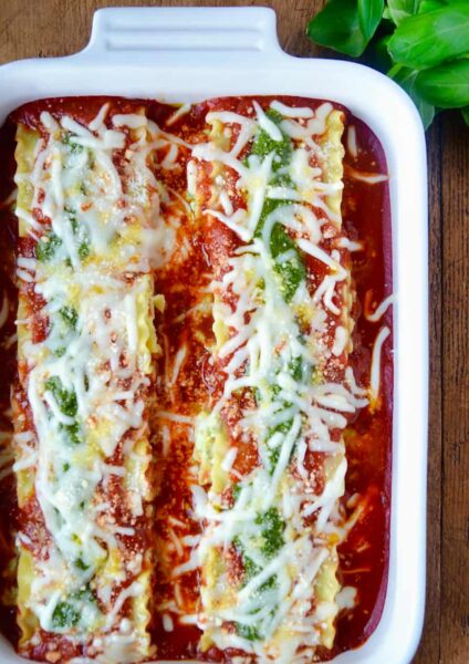 Easy Pesto Lasagna Roll-Ups in white baking dish