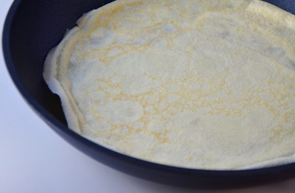 Nonstick sauté pan with crepe.