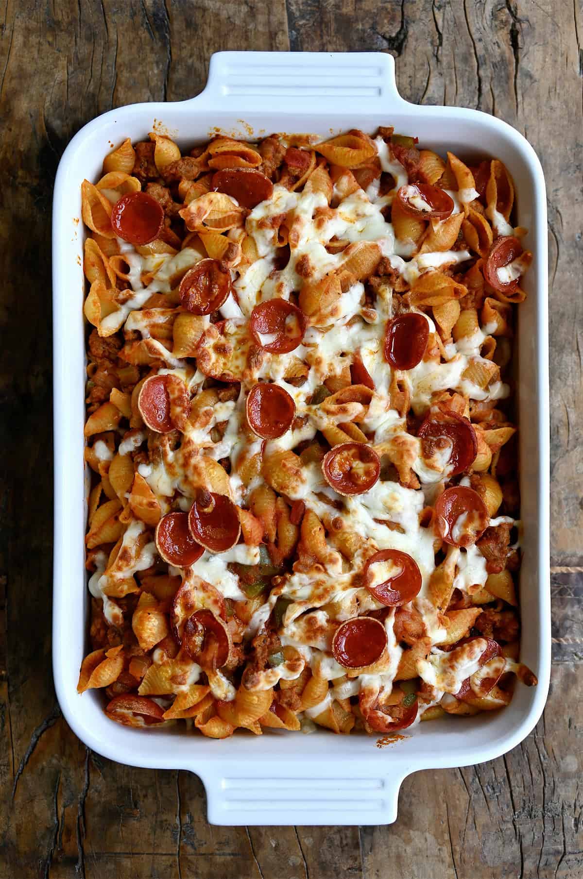 Cheesy pepperoni pizza casserole in a 9x13 baking dish.