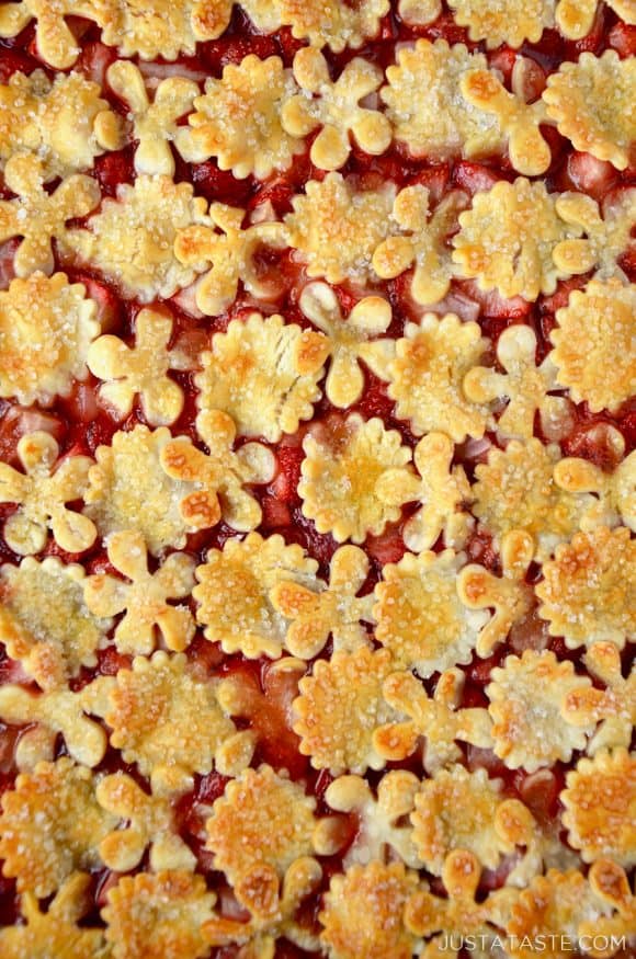 Simple Strawberry Slab Pie with decorative pie dough cutouts.