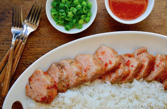 A white plate containing white rice and Sweet and Sour Roast Pork Tenderloin