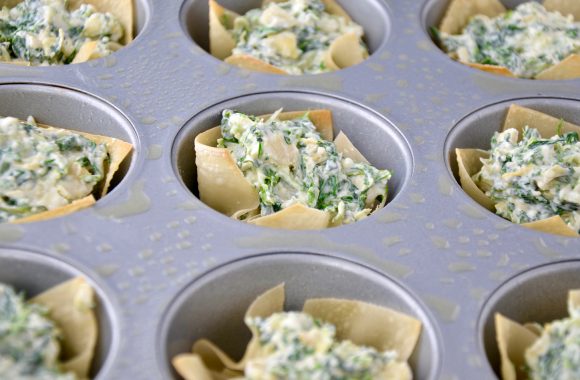 Spinach-Artichoke Dip Wonton Cups in greased muffin tin.