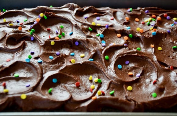 A close-up shot of swirled buttercream frosting with sprinkles 