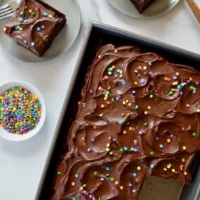 A top-down view of a chocolate cake with buttercream