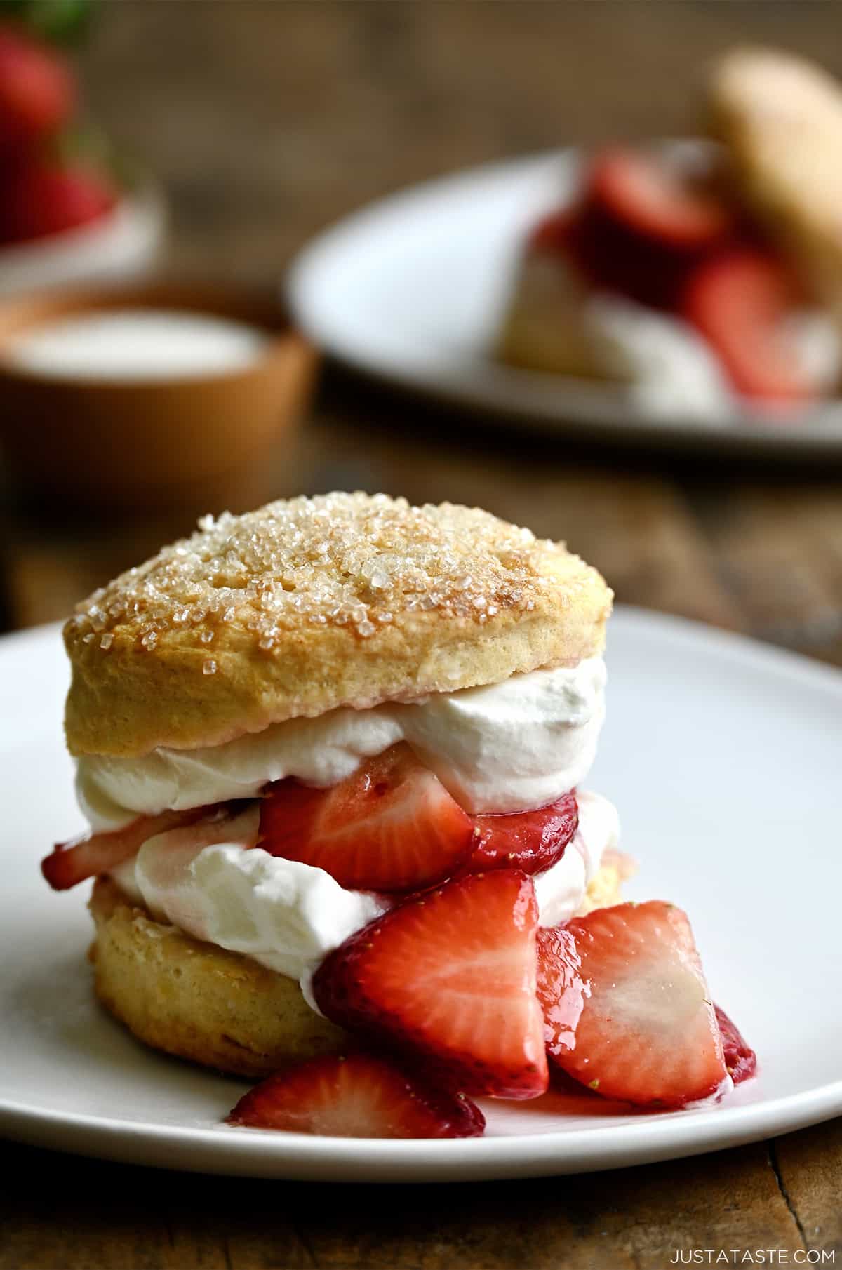 Strawberry shortcake dessert with macerated strawberries and freshly whipped cream.