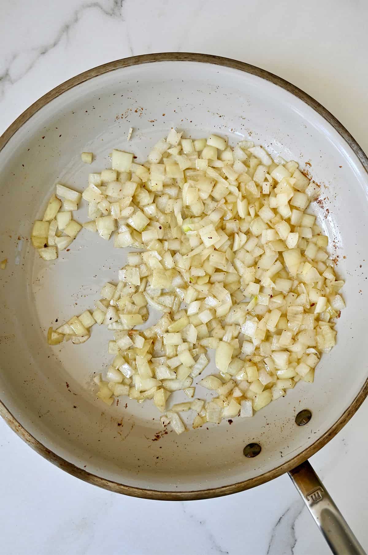 Sautéed diced onions in a large skillet.