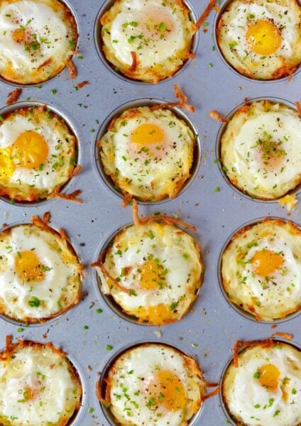 Cheesy Hash Brown Cups with Baked Eggs in a muffin tin