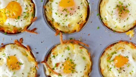Cheesy Hash Brown Cups with Baked Eggs in a muffin tin