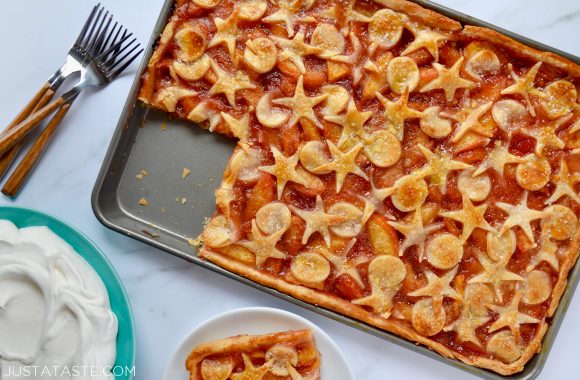 Easy Peach Slab Pie with a single square serving cutout