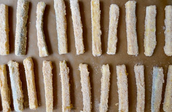 Zucchini fries on baking sheet prior to baking