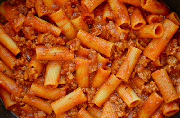 Cooked pasta with Italian sausage in pot
