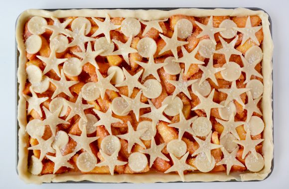 Unbaked Easy Peach Slab Pie with decorative cutouts