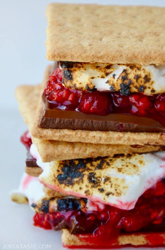 Stack of s'mores with chocolate and raspberries