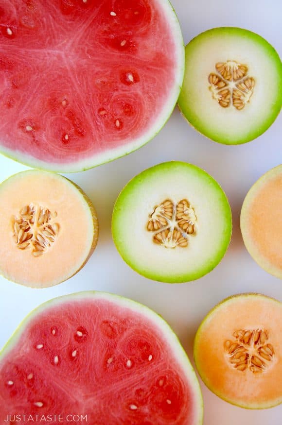 Watermelons, cantaloupes and honeydew melons cut in half