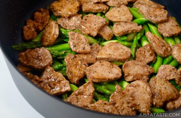 Quick Black Pepper Pork with asparagus in skillet