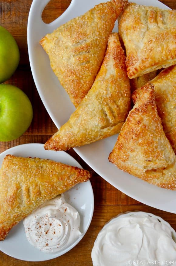 Easy Apple Turnovers on serving plate with whipped cream