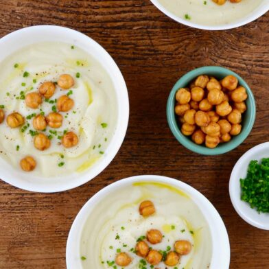 Three bowls with Quick Cauliflower Soup topped with roasted chickpeas