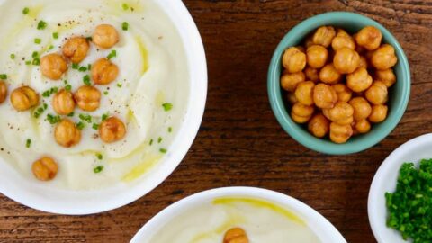 Three bowls with Quick Cauliflower Soup topped with roasted chickpeas