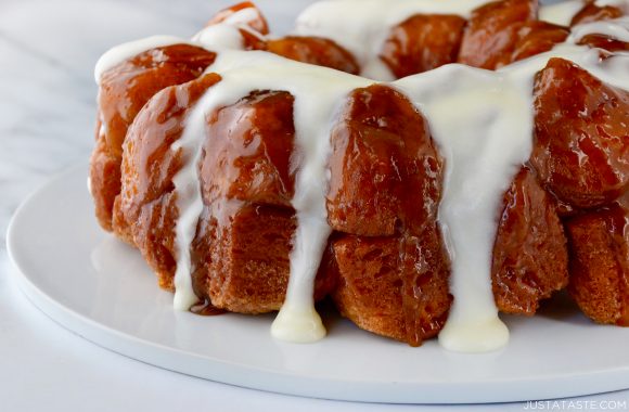 Monkey Bread with Cream Cheese Glaze on white serving plate