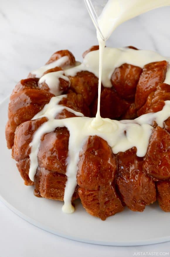 Monkey Bread with Cream Cheese Glaze being poured over top