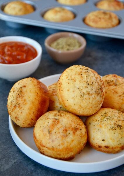 Muffin Tin Pizza Pockets on plate with marinara sauce