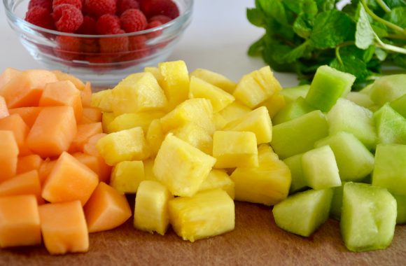 Chopped up fruit on a cutting board