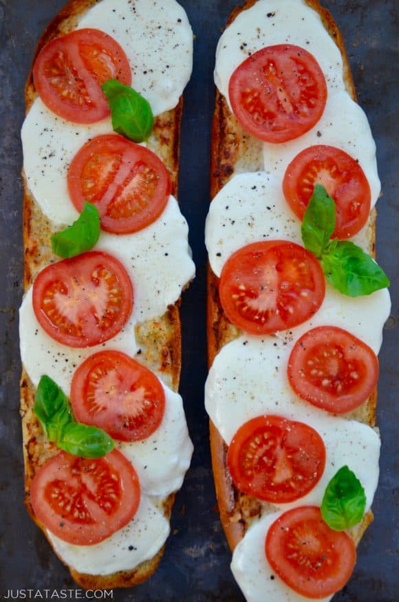 A top down view of two halves of Caprese Garlic Bread