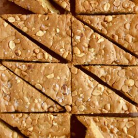 A top down view of Double Peanut Butter Blondies sliced into triangles