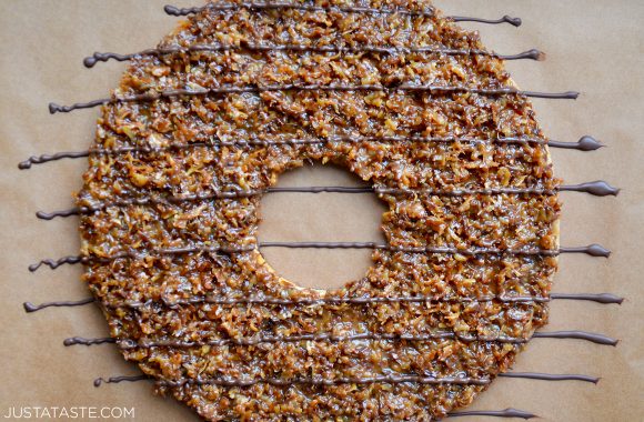 Top down view of Giant Samoas Cookie Cake drizzled with chocolate 