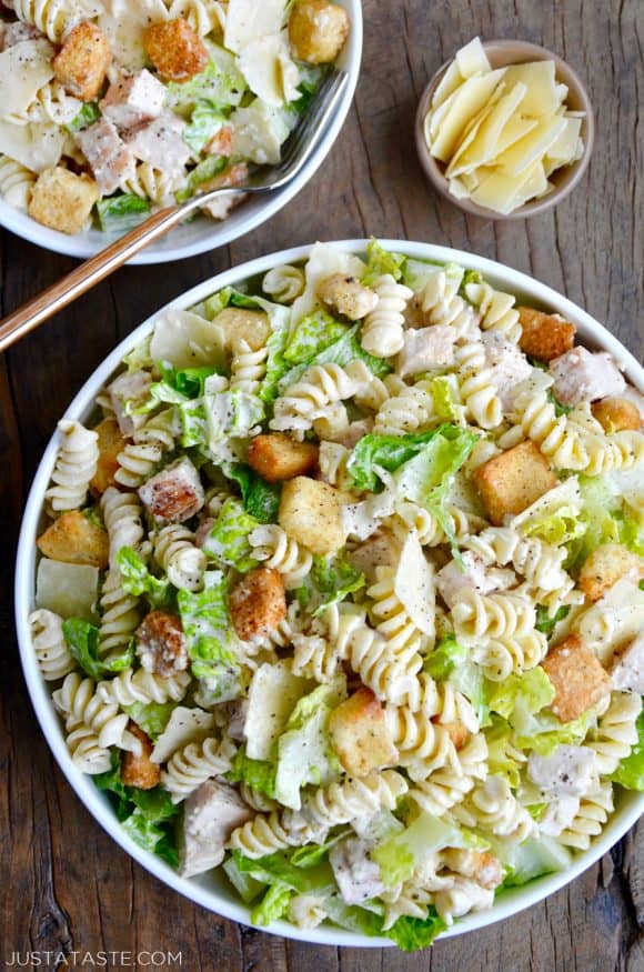 A top down view of a bowl containing the best Chicken Caesar Pasta Salad