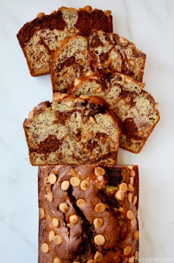 A top down view of a loaf of Chocolate Peanut Butter Banana Bread cut into slices