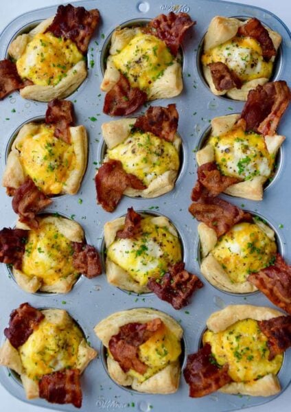 Muffin pan containing Bacon, Egg and Cheese Toast Cups