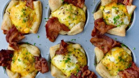 Muffin pan containing Bacon, Egg and Cheese Toast Cups