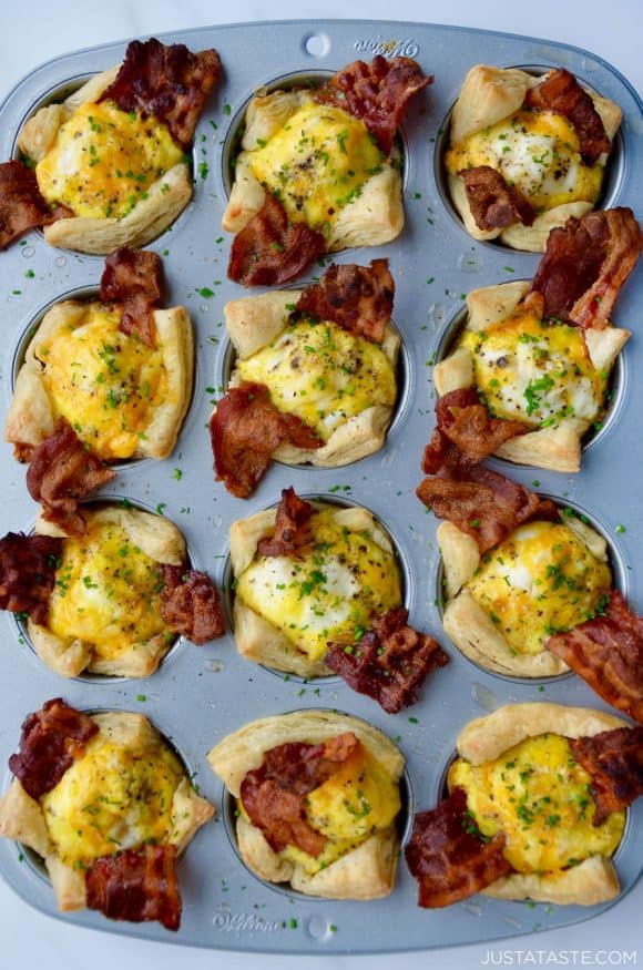 Muffin pan containing Bacon, Egg and Cheese Toast Cups