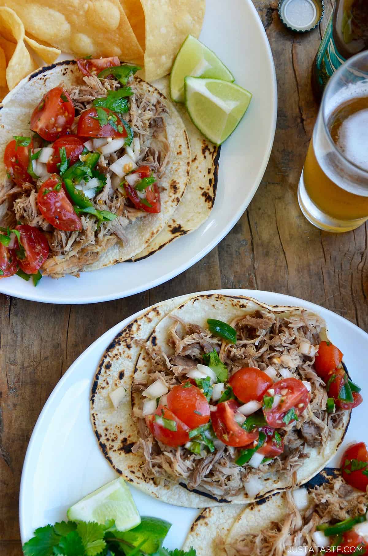 Crispy pork carnitas atop corn tortillas, topped with a cherry tomato pico de gallo and cilantro.