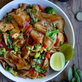 White bowl containing easy homemade drunken noodles with chicken