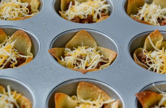Taco salad cups with ground beef and shredded cheeses
