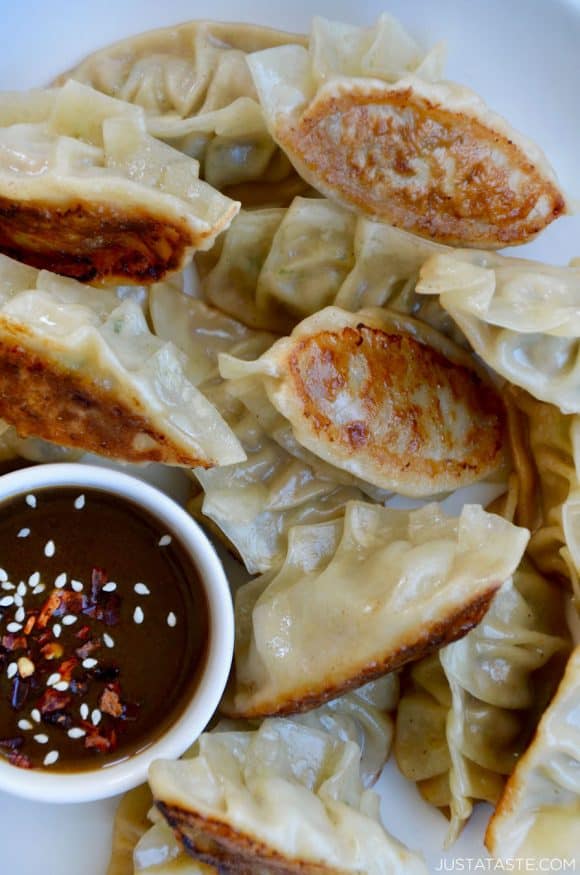 Closeup view of homemade Pork Potstickers with Citrus-Soy Dipping Sauce