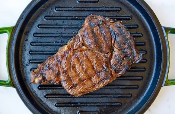 Seared ribeye steak on grill pan
