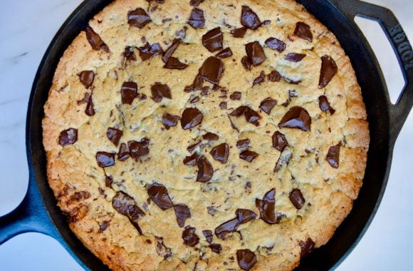 Top down view of freshly baked skillet chocolate chip cookie